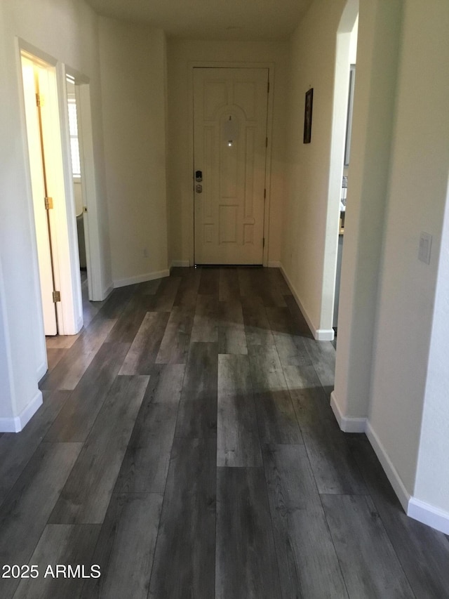 10489 S 182nd Dr, Goodyear, AZ 85338 - hallway with dark wood-style flooring and baseboards