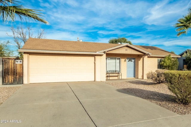 single story home featuring a garage