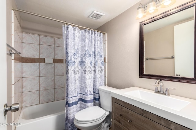 full bathroom with vanity, toilet, and shower / bath combo with shower curtain