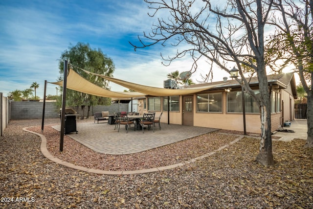 back of house with a patio area