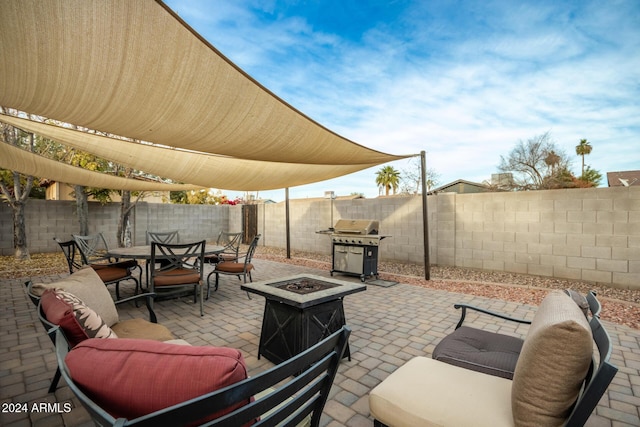 view of patio / terrace featuring a fire pit and a grill