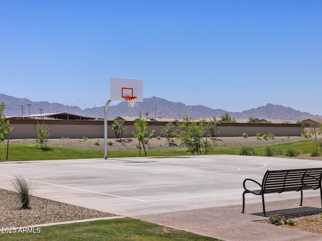 exterior space featuring community basketball court and a mountain view