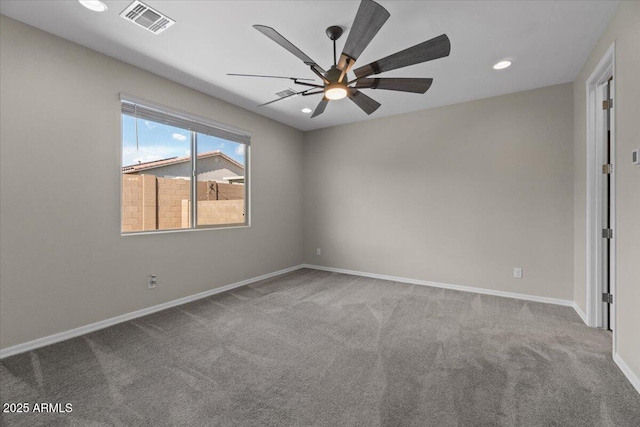 empty room featuring carpet floors, ceiling fan, baseboards, and visible vents