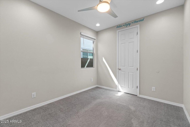 carpeted empty room with baseboards, ceiling fan, and recessed lighting