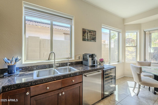 kitchen featuring a sink, wine cooler, dishwasher, and tile countertops