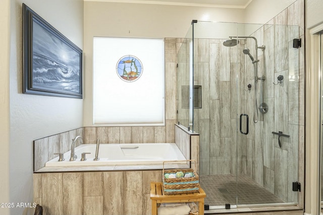 bathroom featuring a bath and a stall shower