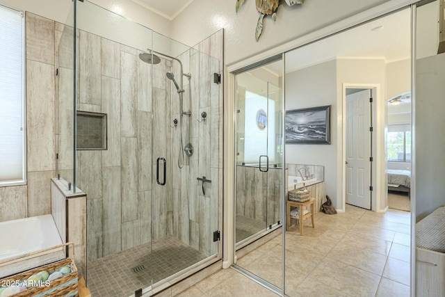 ensuite bathroom with a stall shower, connected bathroom, a garden tub, and ornamental molding