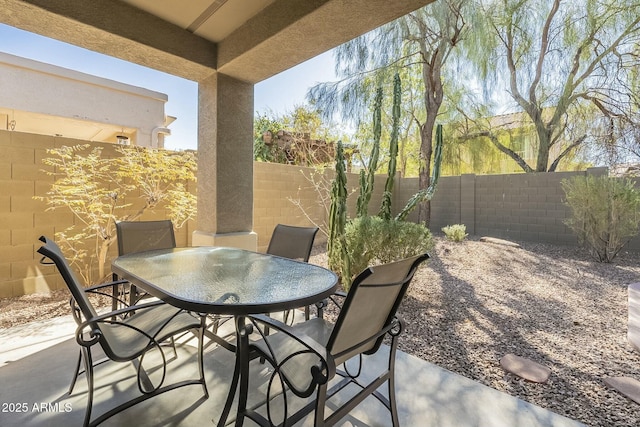 view of patio / terrace featuring outdoor dining space and a fenced backyard