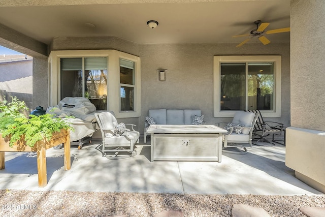 view of patio featuring an outdoor living space and a ceiling fan