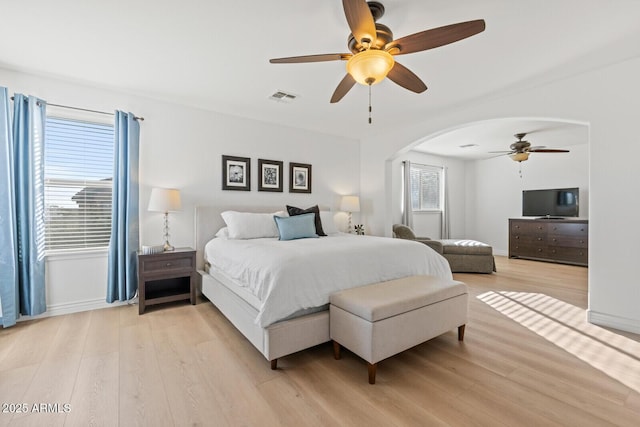 bedroom with ceiling fan and light hardwood / wood-style flooring