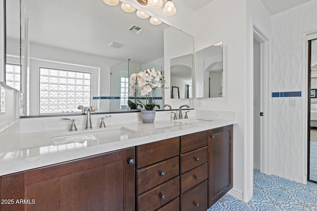 bathroom featuring vanity and tile patterned flooring