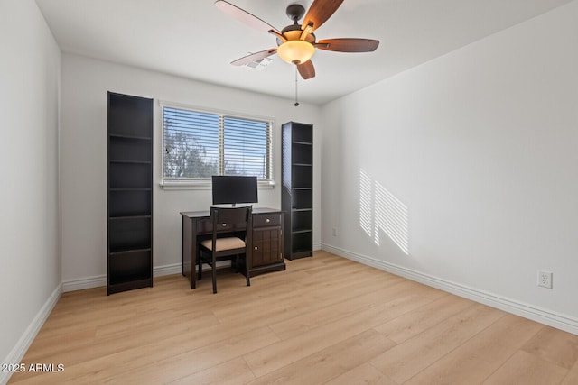 office area with light wood-type flooring and ceiling fan