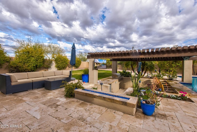 view of patio with an outdoor kitchen, an outdoor living space, and area for grilling