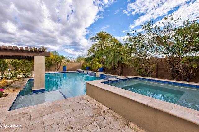 view of pool with an in ground hot tub