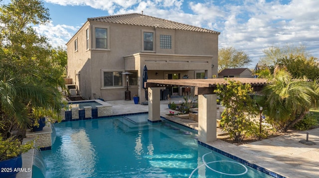 view of swimming pool featuring an in ground hot tub, a patio area, and pool water feature