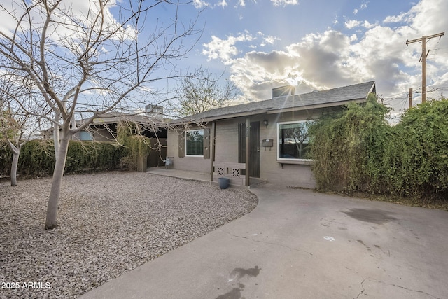 view of front of house featuring concrete block siding