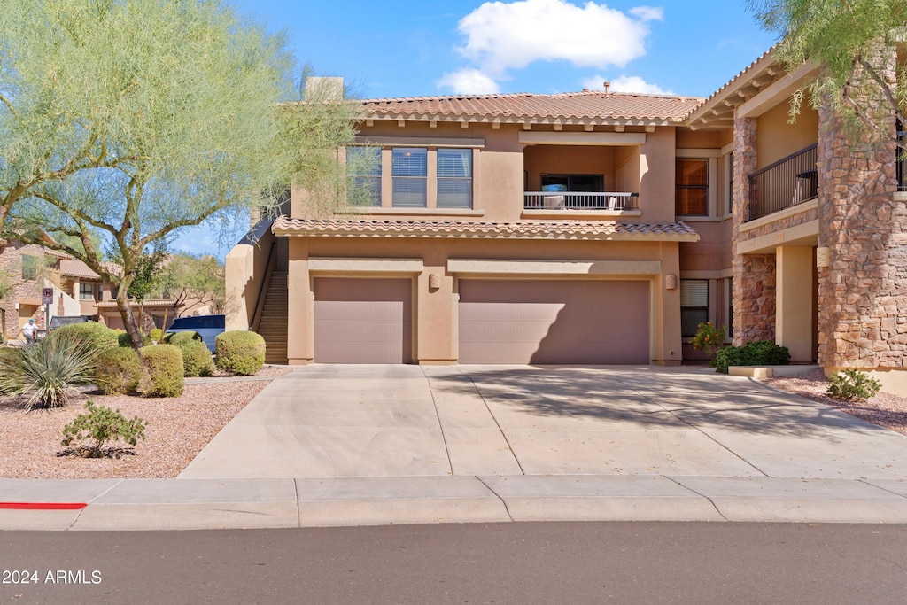 mediterranean / spanish-style house featuring a garage