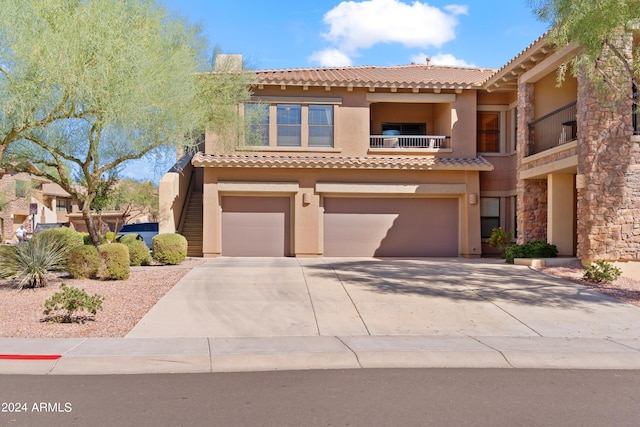 mediterranean / spanish-style house featuring a garage