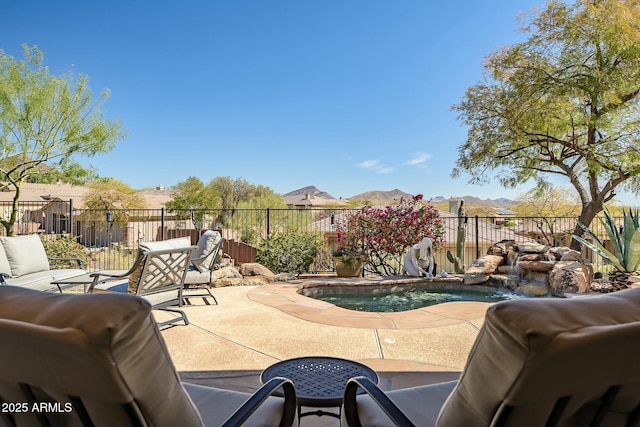 view of patio / terrace featuring a fenced in pool and a fenced backyard