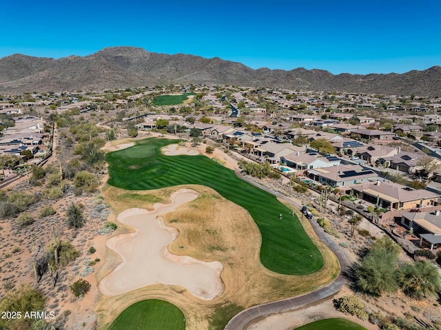 aerial view with a residential view, a mountain view, and golf course view