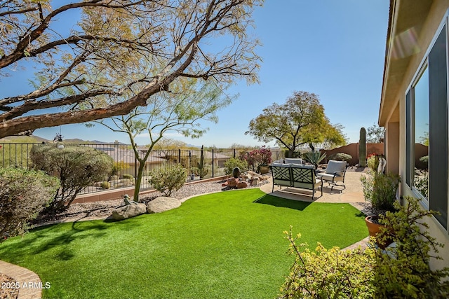 view of yard with a fenced backyard, a patio, and an outdoor living space