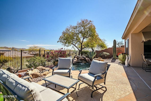 view of patio / terrace with a fenced backyard and an outdoor hangout area