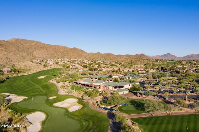 aerial view featuring view of golf course, a residential view, and a mountain view
