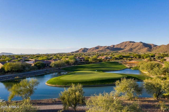 surrounding community with view of golf course and a water and mountain view