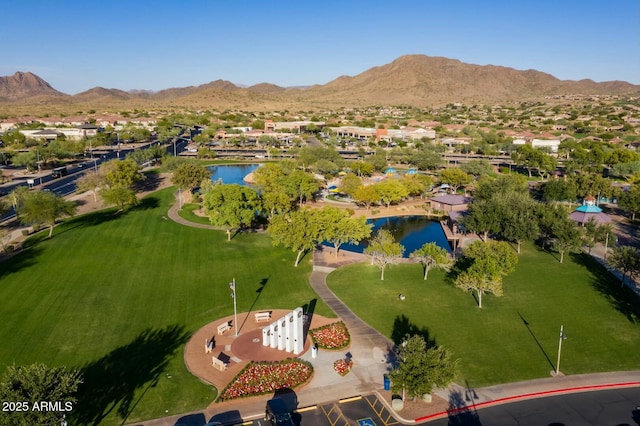 bird's eye view with a water and mountain view