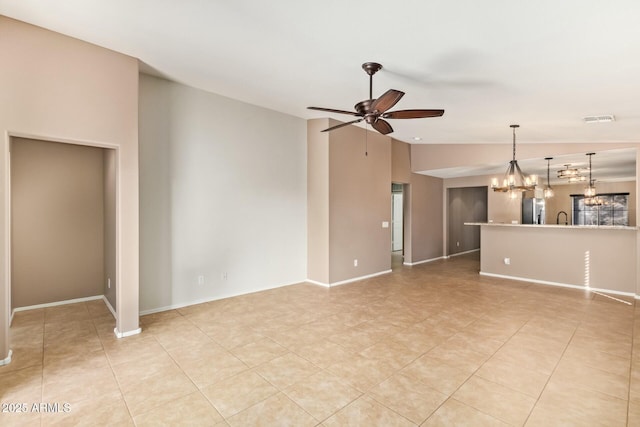 unfurnished living room with visible vents, light tile patterned flooring, vaulted ceiling, a sink, and ceiling fan with notable chandelier