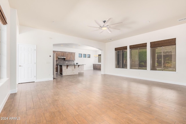 5713 W Rowel Rd, Phoenix, AZ 85083 - unfurnished living room with ceiling fan and light hardwood / wood-style flooring