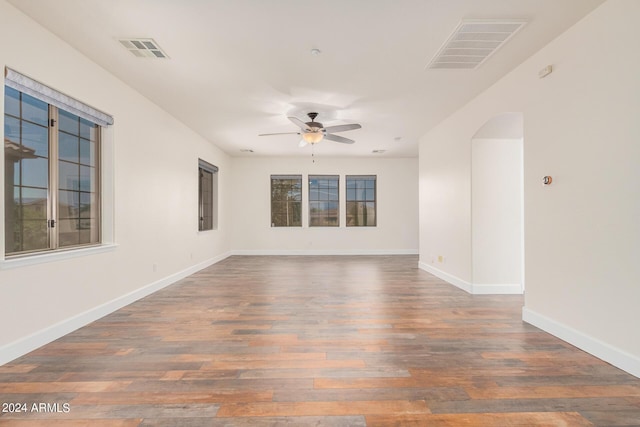 5713 W Rowel Rd, Phoenix, AZ 85083 - spare room featuring ceiling fan, plenty of natural light, and dark hardwood / wood-style flooring