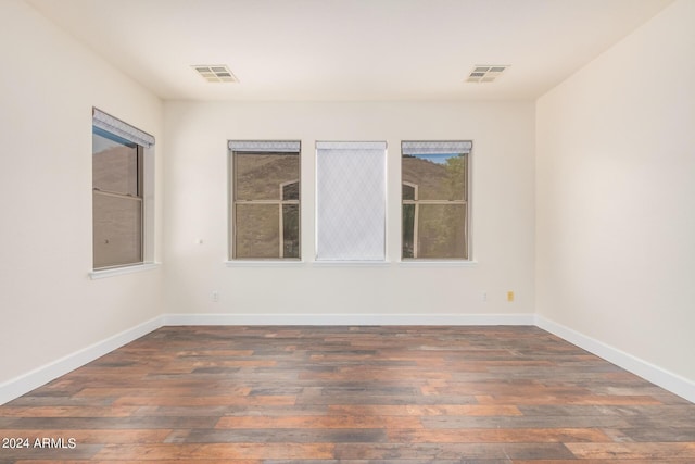5713 W Rowel Rd, Phoenix, AZ 85083 - spare room featuring dark wood-type flooring