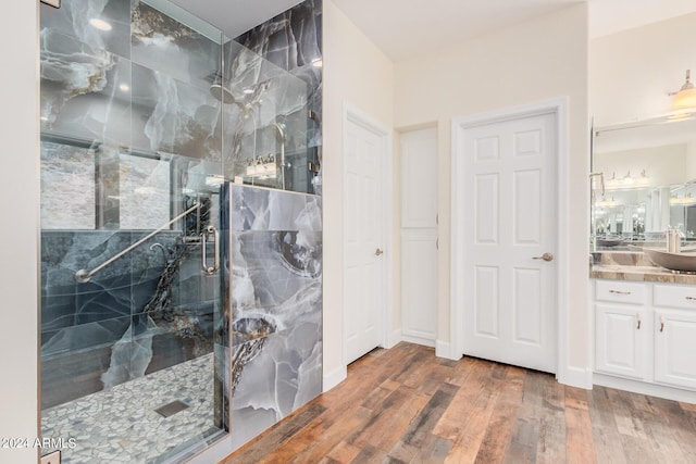5713 W Rowel Rd, Phoenix, AZ 85083 - bathroom featuring wood-type flooring, an enclosed shower, and vanity