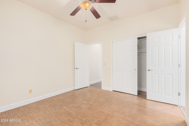 5713 W Rowel Rd, Phoenix, AZ 85083 - unfurnished bedroom featuring a closet, ceiling fan, and light hardwood / wood-style flooring