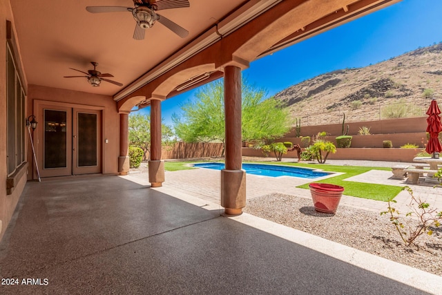 5713 W Rowel Rd, Phoenix, AZ 85083 - view of pool with french doors, ceiling fan, a mountain view, and a patio