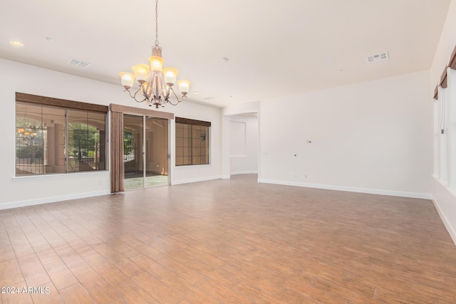 5713 W Rowel Rd, Phoenix, AZ 85083 - interior space with an inviting chandelier, wood-type flooring, and plenty of natural light
