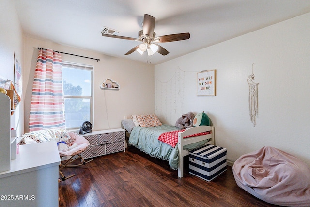 bedroom featuring dark wood-type flooring and ceiling fan