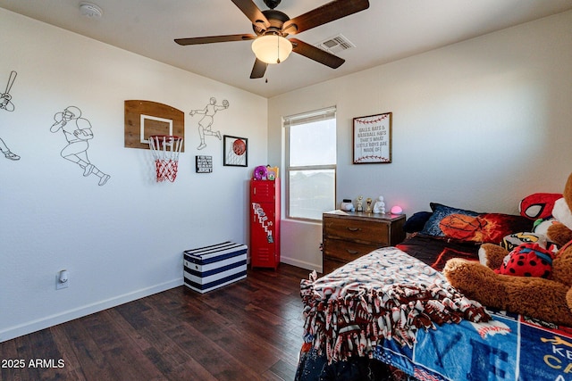 bedroom with ceiling fan and dark hardwood / wood-style floors