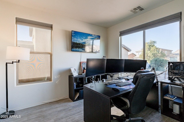 office area with hardwood / wood-style floors