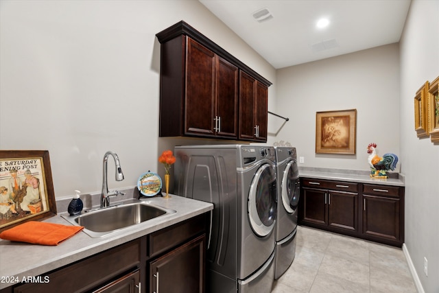 washroom with cabinets, separate washer and dryer, sink, and light tile patterned floors