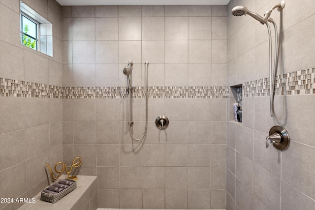 bathroom with tiled shower