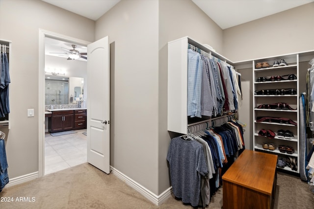 spacious closet featuring ceiling fan and light tile patterned floors