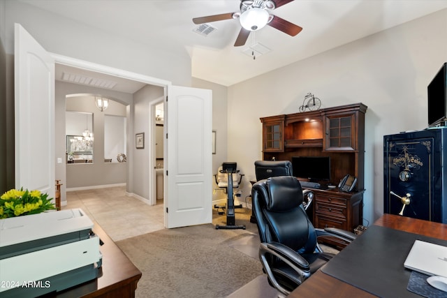 carpeted office space with ceiling fan with notable chandelier