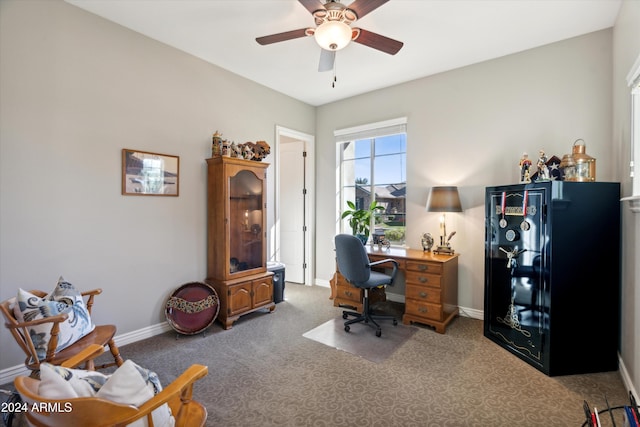 carpeted office space with ceiling fan