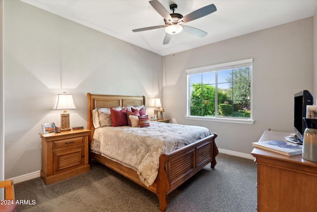 bedroom featuring dark carpet and ceiling fan