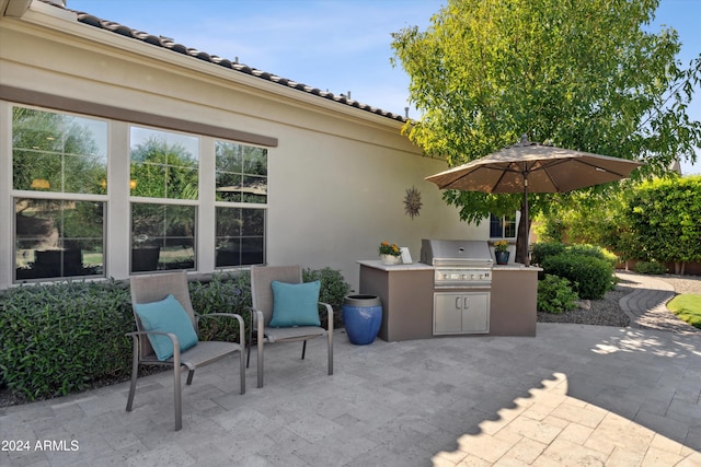 view of patio with area for grilling and grilling area