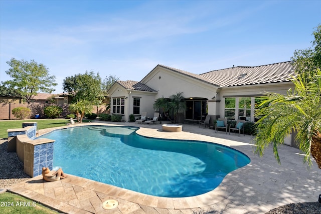 view of swimming pool featuring a patio area