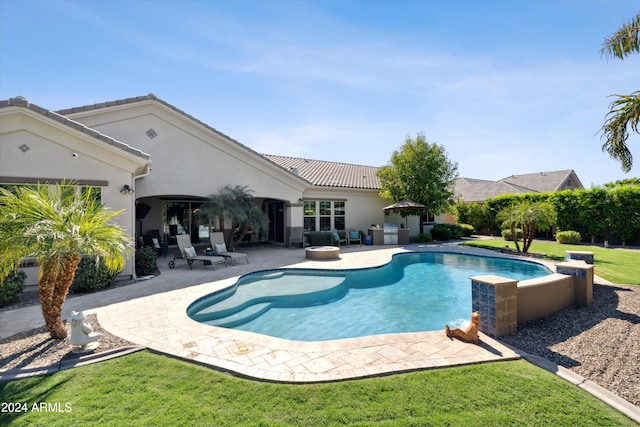 view of pool featuring a patio and a lawn