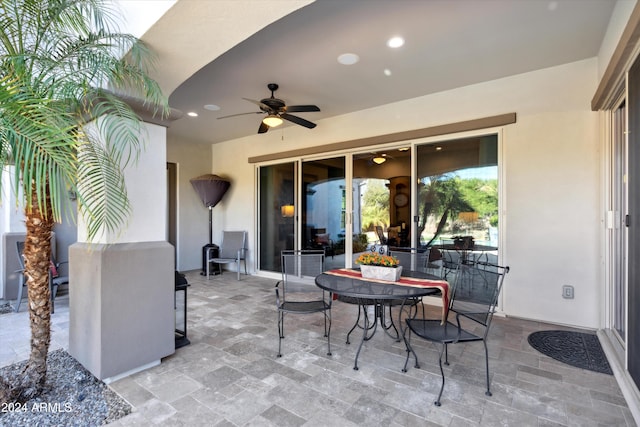 view of patio featuring ceiling fan